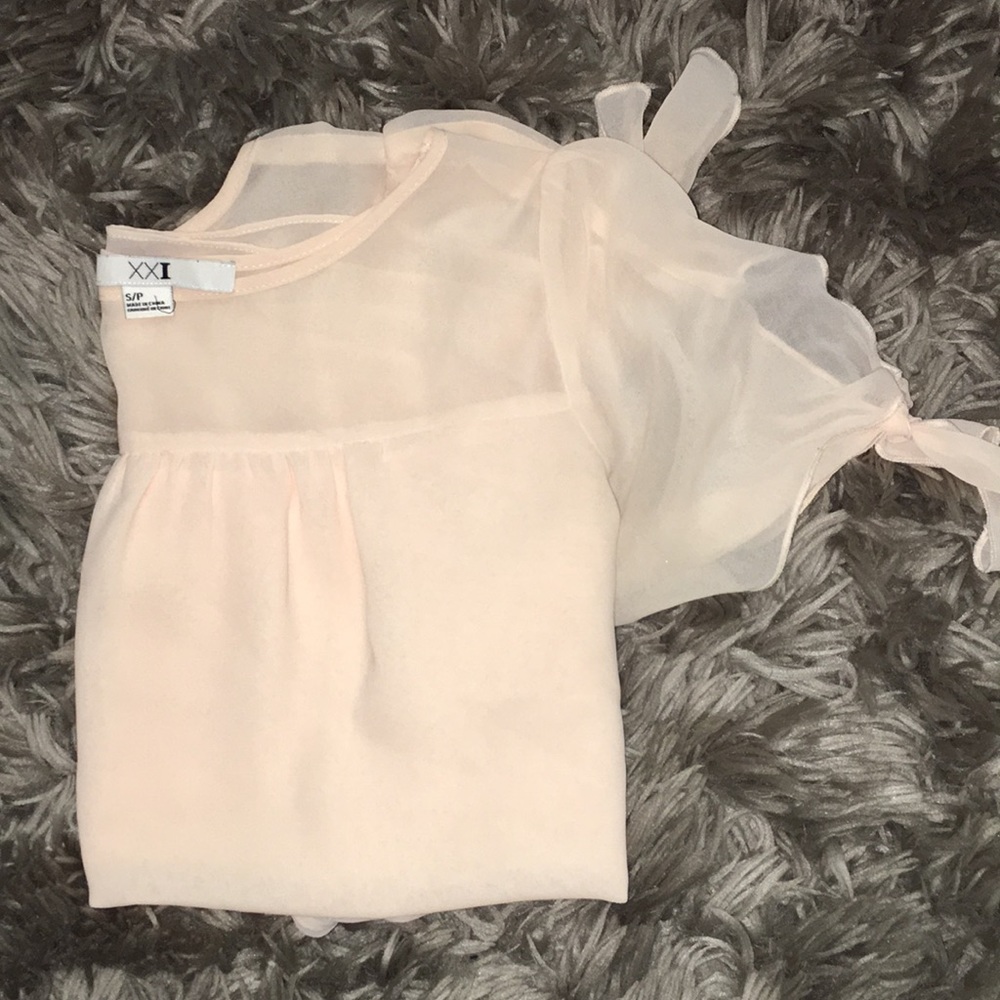 Light pink blouse with bow sleeves